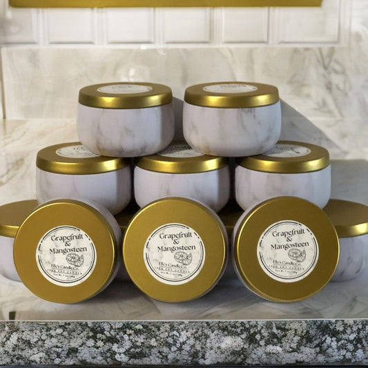 Grapefruit & Mangosteen soy candle in a glass jar, with citrus notes of grapefruit and tropical fruit, styled on a light surface.
