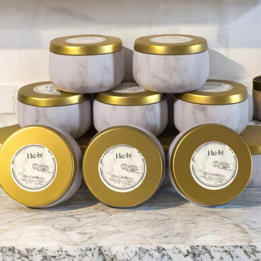 He Is soy candle in a frosted jar, with a clean, masculine scent blend, photographed against a modern neutral background.