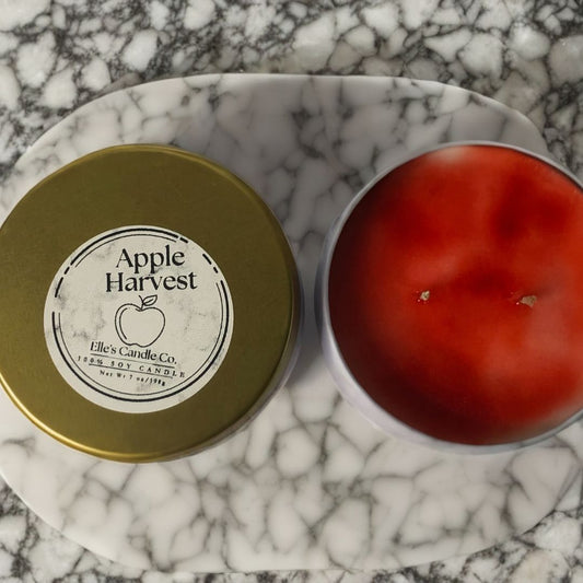 Apple Harvest soy candle in a glass jar, scented with crisp apple and warm cinnamon, shown on a white background.